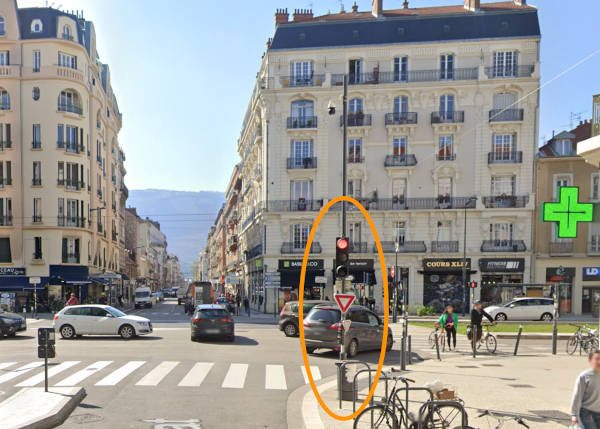 In France, traffic lights are located before the intersection at crossroads.